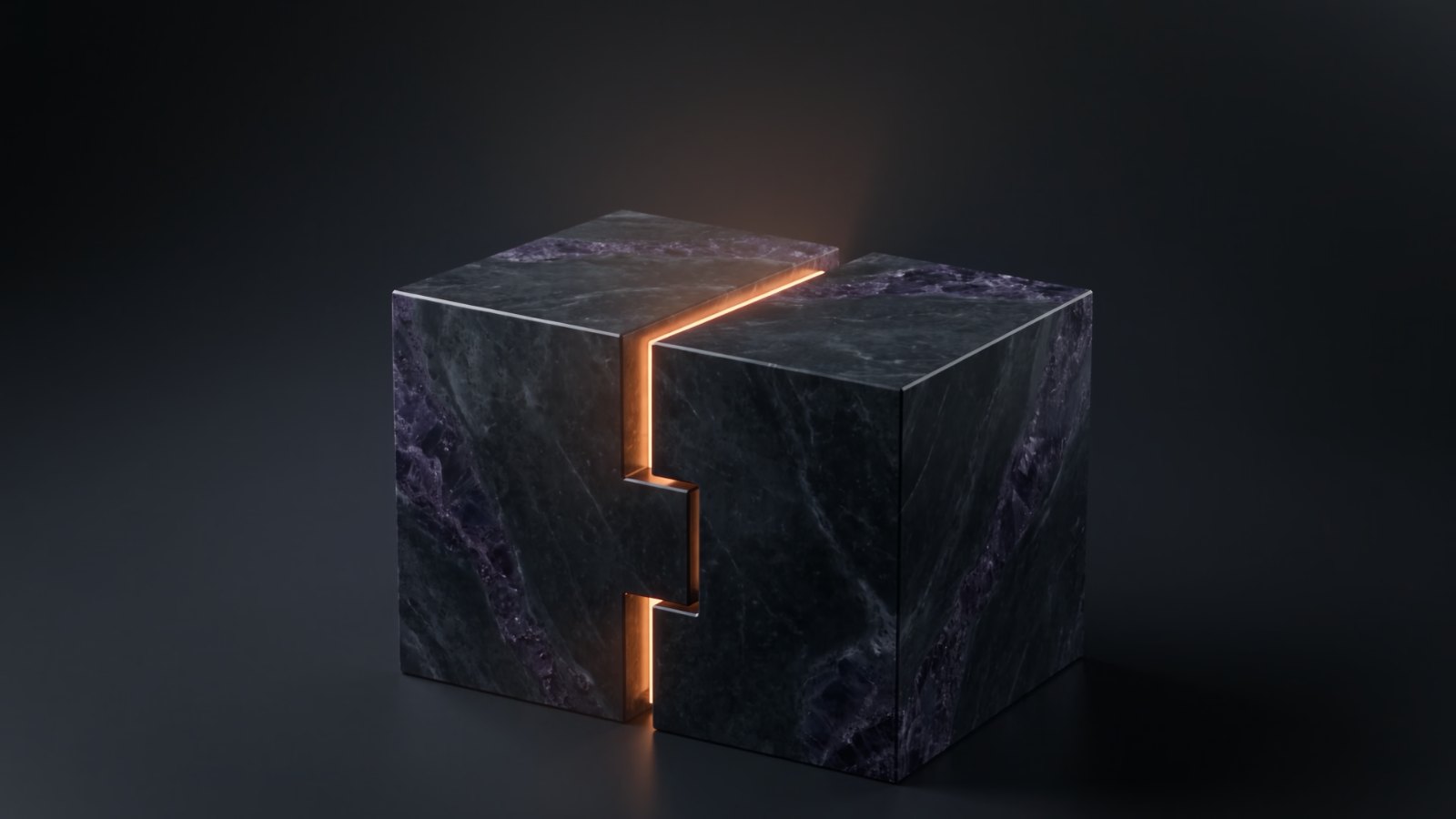 Two halves of a dark marble block locked together along a single glowing amber seam