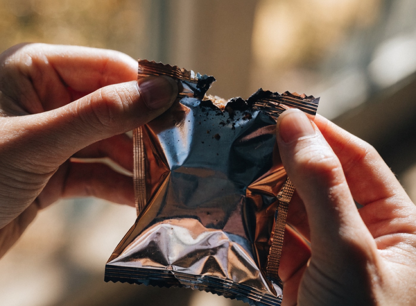 Close up of the packaging held in two hands