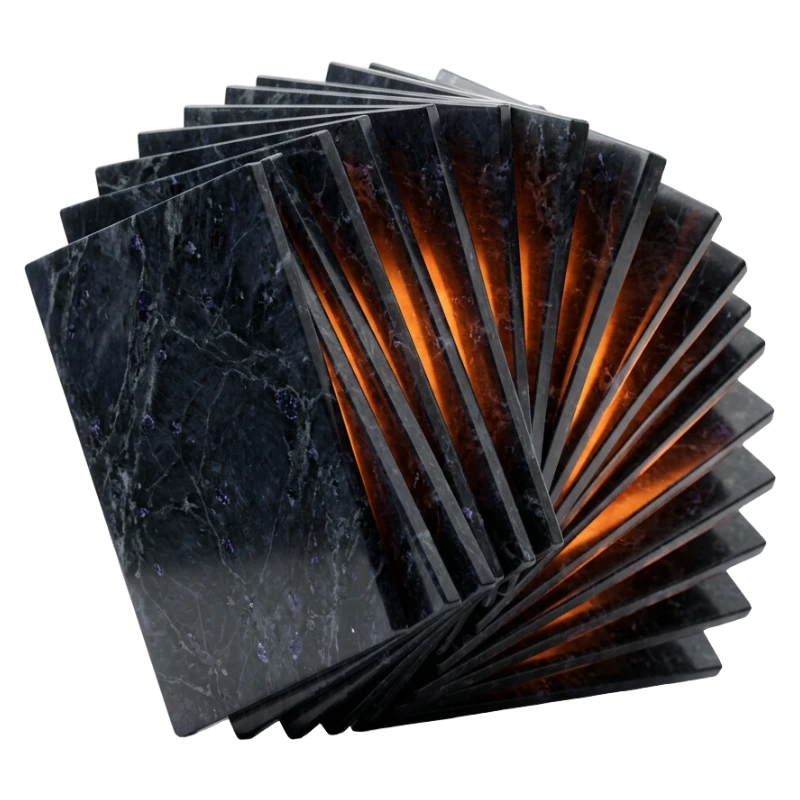 A dark sapphire marble block stepping outward into a widening arc of identical plates, amber light in the gaps between them