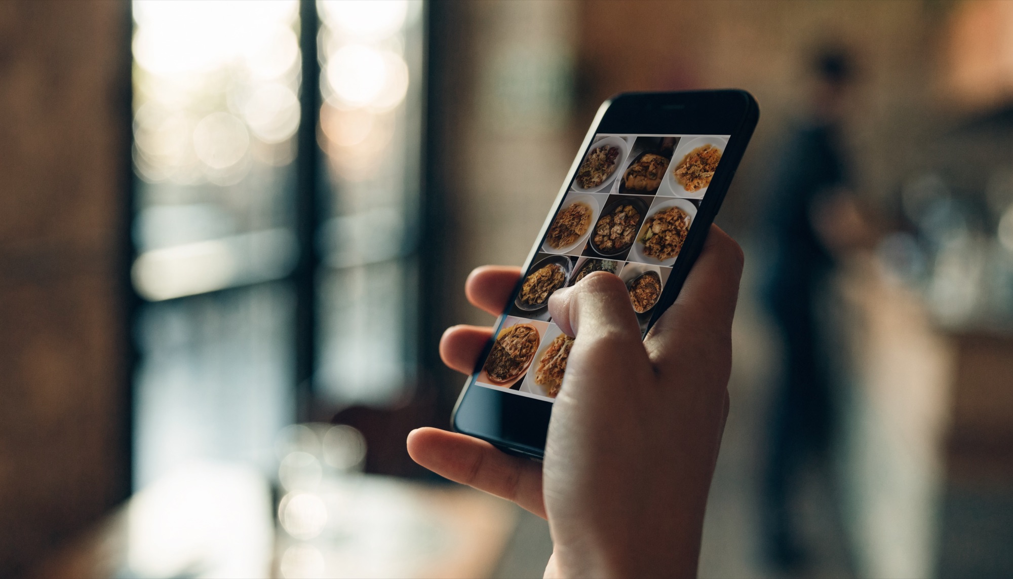 A social media grid of food content on a phone